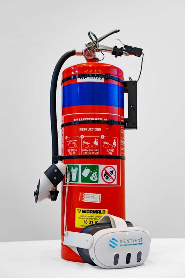A de-gassed fire extinguisher fitted with Sentient's Bluetooth hardware, paired with a VR headset